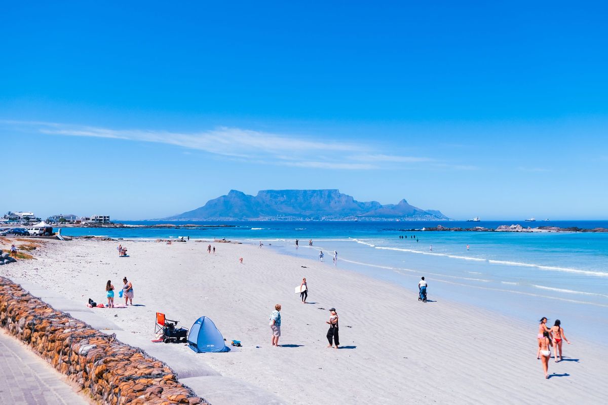 A Cape Town beach with Table Mountain across the bay
